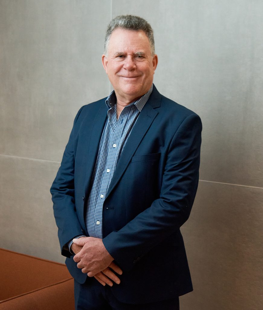 A professional portrait of David Timmins