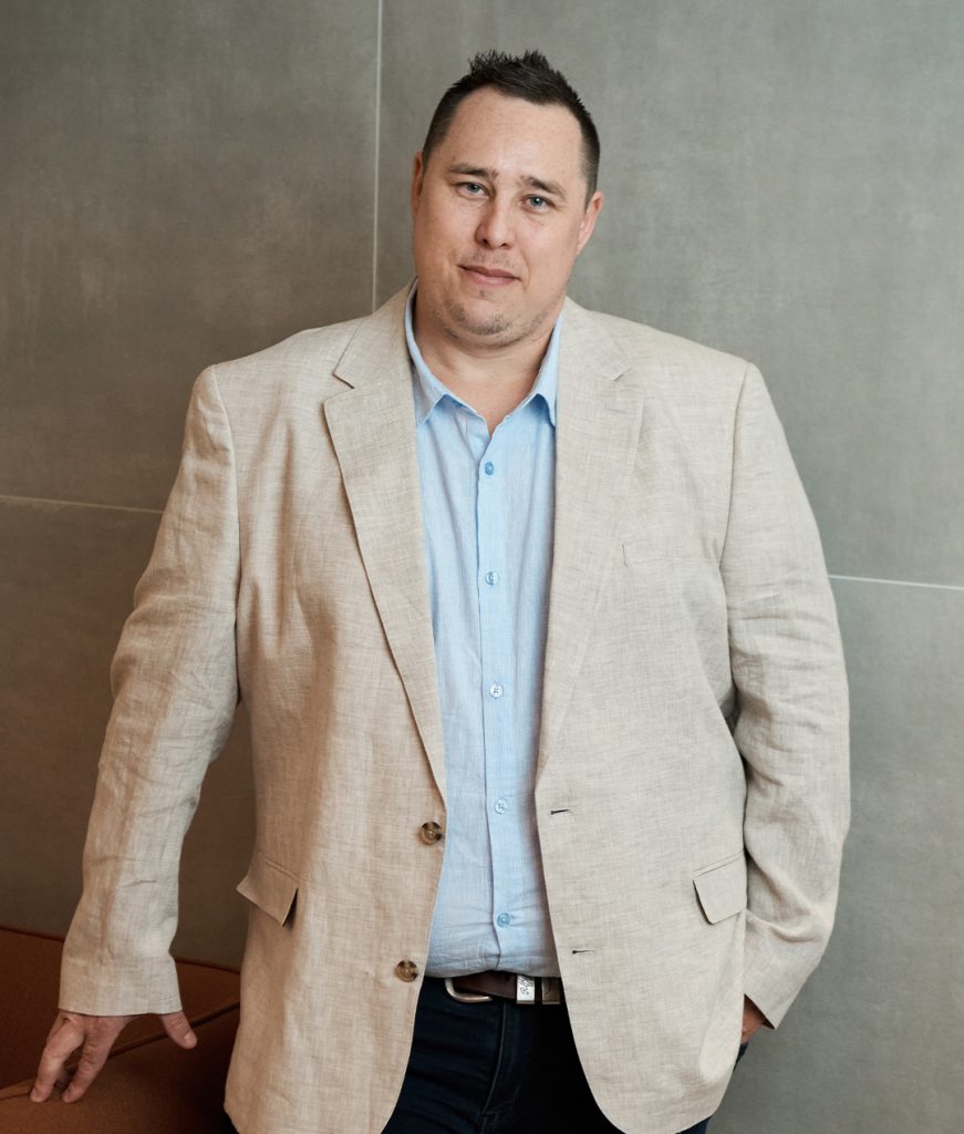 A professional portrait of Dean Taaffe